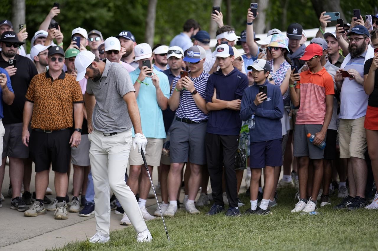 Adam Hadwin of Canada is tied for second place, trailing Scottie Scheffler by four shots at the Memorial tournament.