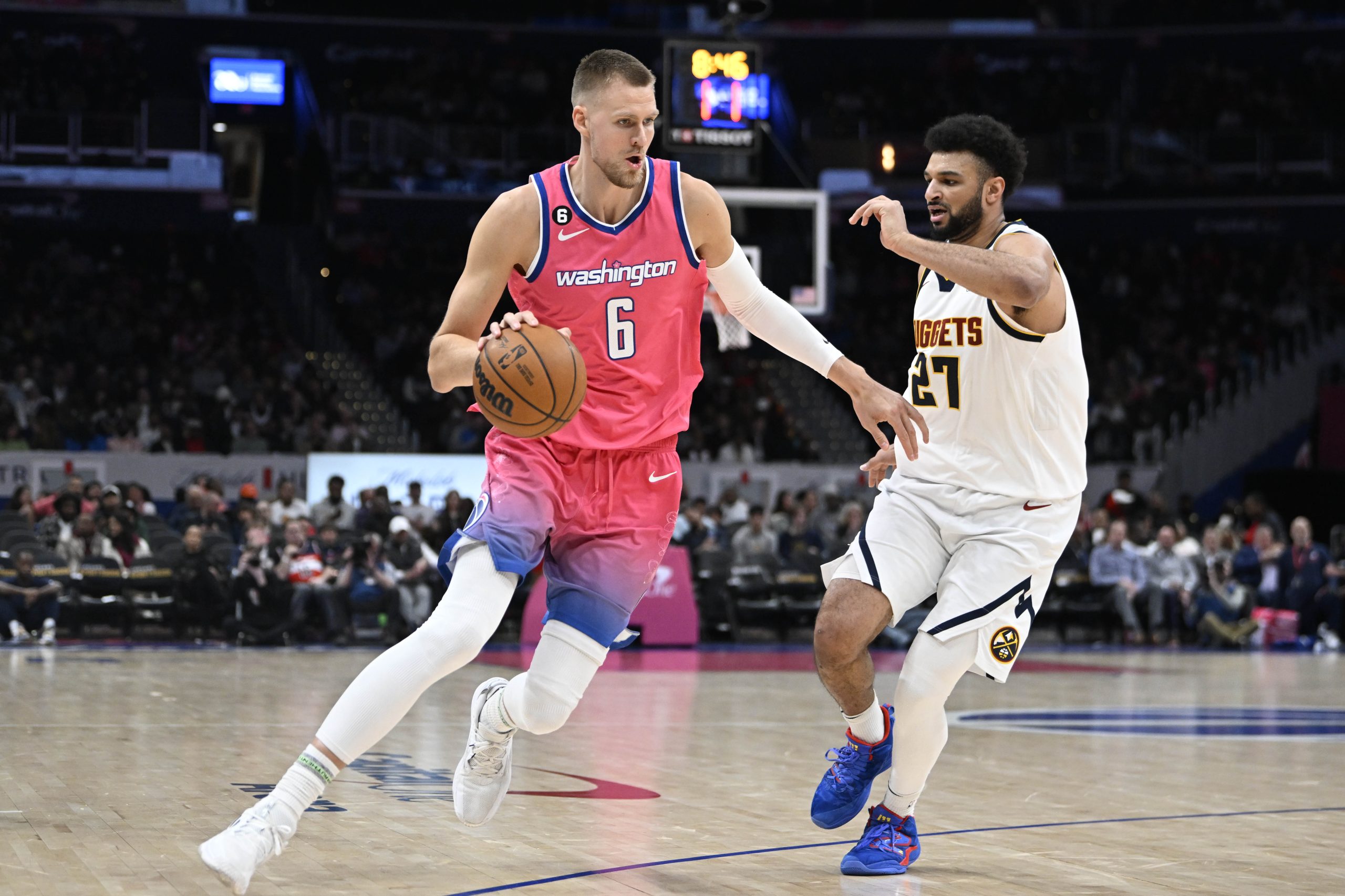 Porzingis makes a defensive play on Green in transition by blocking his shot at the rim