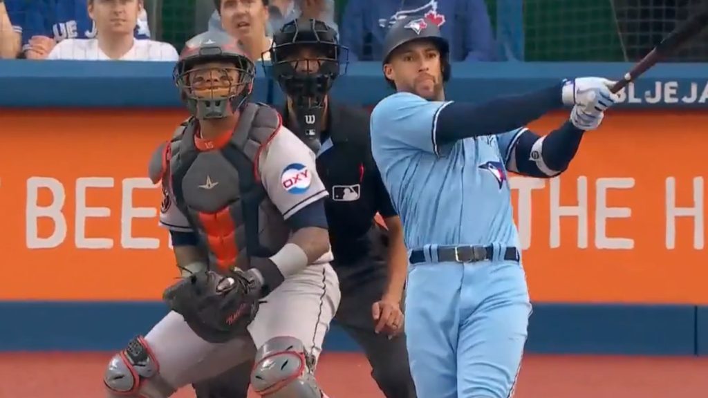 Springer of the Blue Jays makes a crucial diving catch to prevent a run from scoring at the end of the inning.