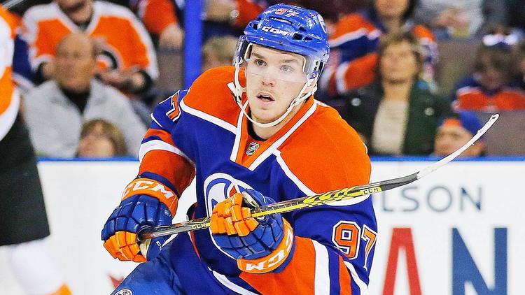 What qualities make McDavid a great captain and leader?