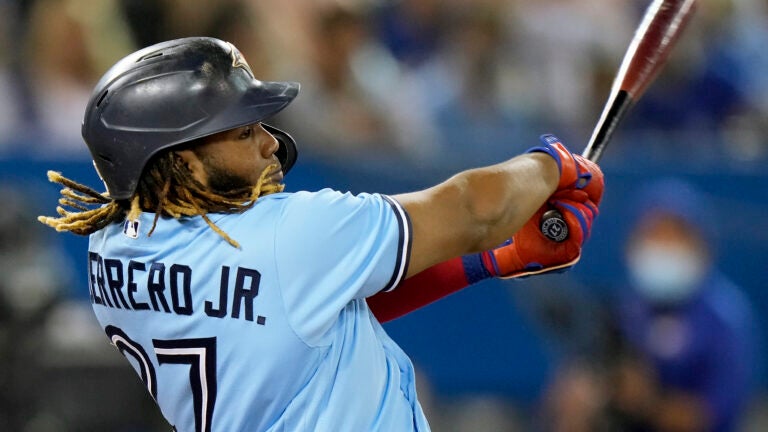 Vladimir Guerrero Jr. of the Blue Jays hits a home run into the second deck