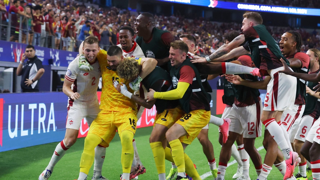 Shaffelburg of Canada scores by placing shot in bottom corner against USA